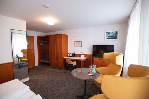 Comfort Plus Room at Hotel am Main with seating area and tea station