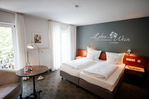 Comfort Plus Room at Hotel am Main Veitshöchheim, spacious with a seating area