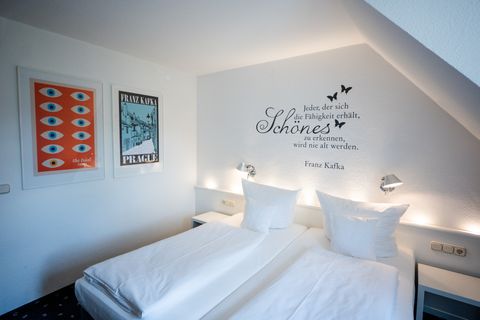 Standard Room at Hotel am Main Veitshöchheim with literary wall design